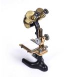 An early 20th century Bausch & Lomb Optical Co binocular microscope serial number 244189, 13cm