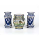 A pair of majolica glazed albarello each with blue and white double eagle crests, 13cm diameter x