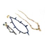Two Roman glass bead necklaces and a Bactrian style Lapis lazuli bead necklace. 40cm in length.