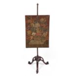 A George III needlework firescreen with a mahogany triopod stand 53cm wide x 148cm highrepairs to