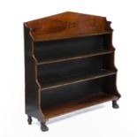 A Regency rosewood four tier waterfall bookcase with lion's paw feet, 122cm wide x 32cm deep x 110cm