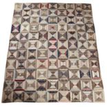 A late Victorian patchwork quilt with rows of cotton squares 186cm x 224cmMoth holes, small tears