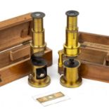 Two late 19th century small drum microscopes both 15.5cm in height with fitted casesAt present,