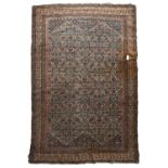 Three antique Eastern rugs to include a Kurdish Melas prayer mat, 118cm x 151cm together with a flat