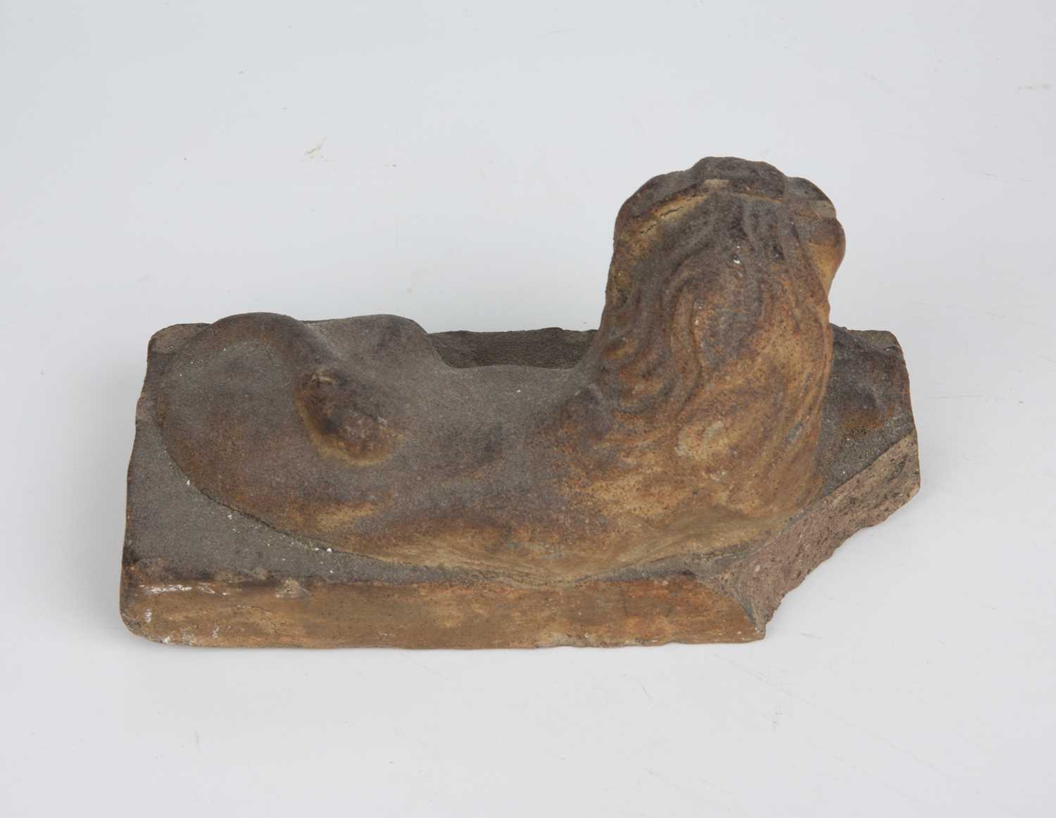 An early 19th century stoneware recumbent lion 17cm wide x 8cm deep x 9.5cm highChip to one - Image 2 of 3