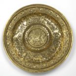 A large 18th century continental pressed brass dish 48cm diameterSmall dents and marks, two small