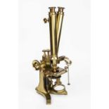A Victorian lacquered brass compound binocular microscope by C Collins, London, with one objective