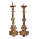 A pair of 18th century Italian giltwood pricket candlesticks 14.5cm wide x 49cm highLead weighted on