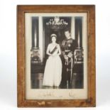 A signed photograph of Queen Elizabeth II and Prince Philip the Duke of Edinburgh dated 1961 the