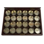 A collection of 24 Victorian patent glass topped sample tins each 5cm diameter 2cm high, all in