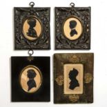 A pair of 19th century silhouette miniatures mounted in pressed brass frames overall, 10cm x 12cm;