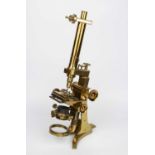 A large Victorian lacquered brass bar-limb monocular compound microscope by Andrew Ross, London,