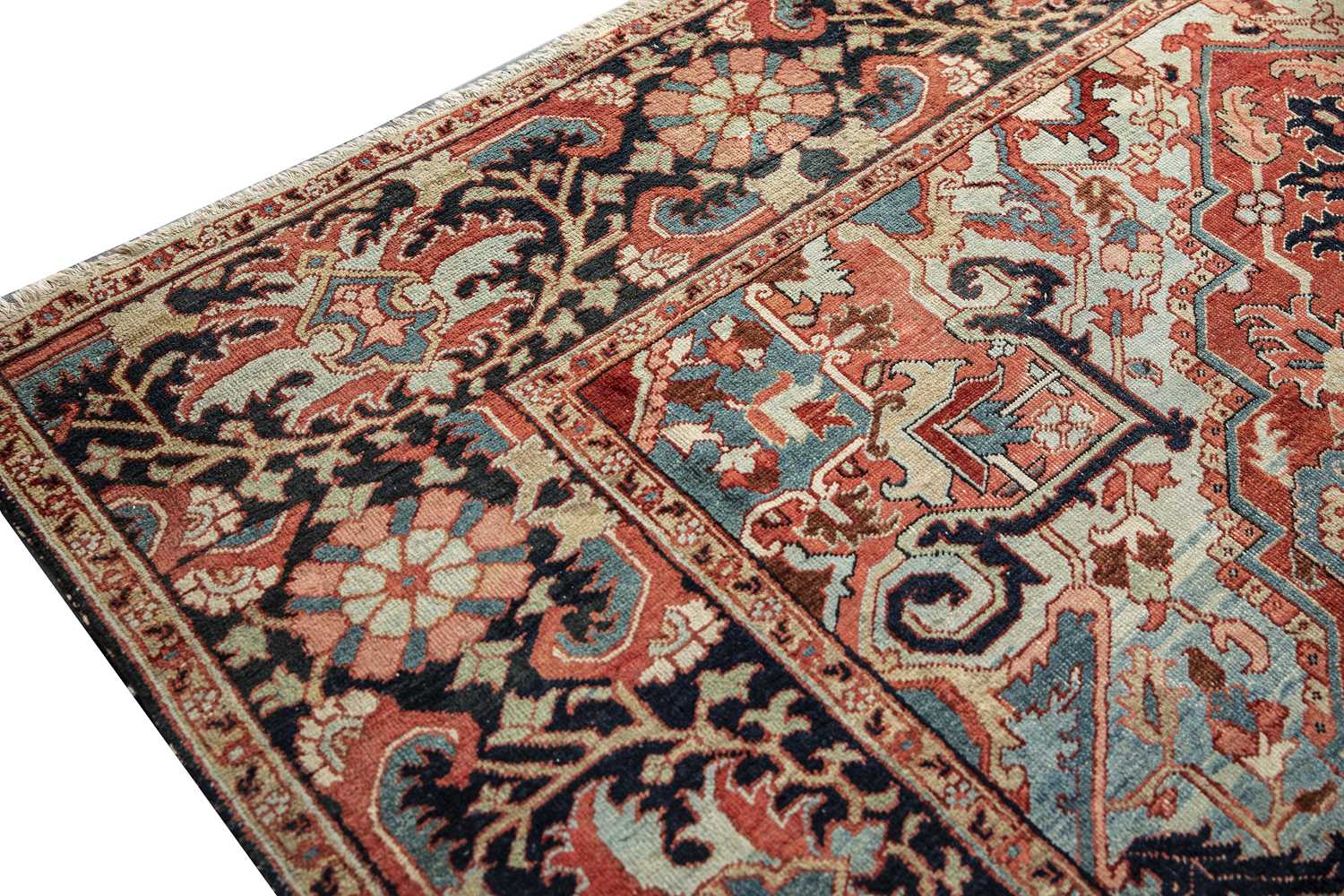 An antique Heriz red ground carpet with geometric decoration 312cm x 412cm old moth damage, - Image 2 of 6