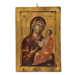 A late 19th / early 20th century Russian Orthodox icon of The Virgin and Child, signed lower