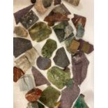 A collection of mineral samples to include porphyry and marble slices