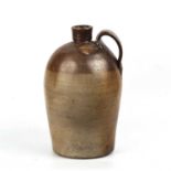 A late 18th/ early 19th century salt glazed stoneware flagon. 22cm wide 41cm high.nGood