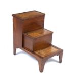 A set of Edwardian mahogany library steps with leather inset tops, two compartments and bracket
