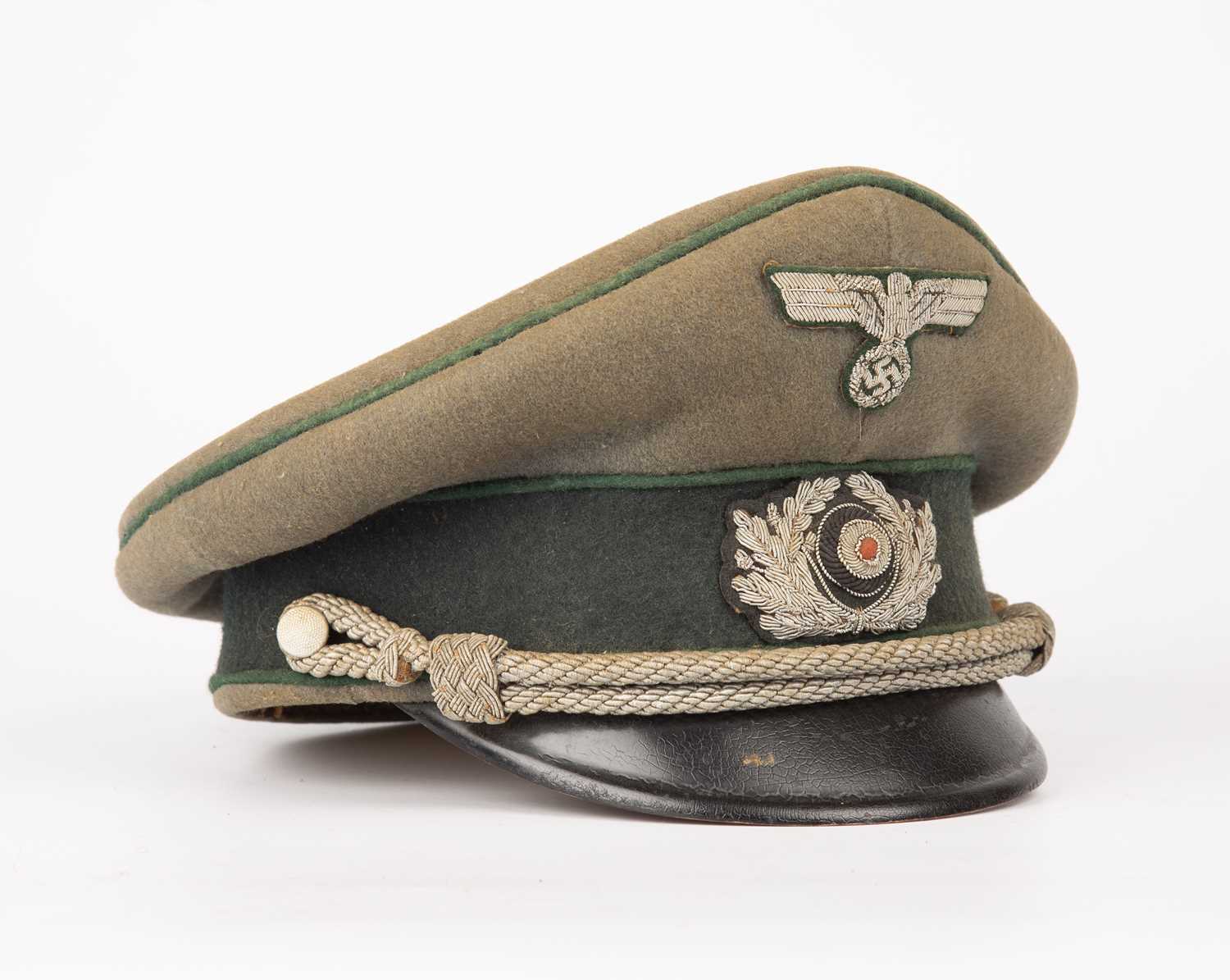 A German World War II infantry officers cap with green cloth and bullion badgesFelt with some