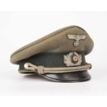 A German World War II infantry officers cap with green cloth and bullion badgesFelt with some