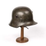 A German World War I model 1916 helmet stamped 'BF62' and 'R383' with original leather liningNo chin