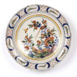 An 18th century Dutch Delft charger 34.5cm diameterRim chips and crazing