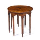 An early 19th century marquetry inlaid circular centre table with eight legs and turned feet, 70cm
