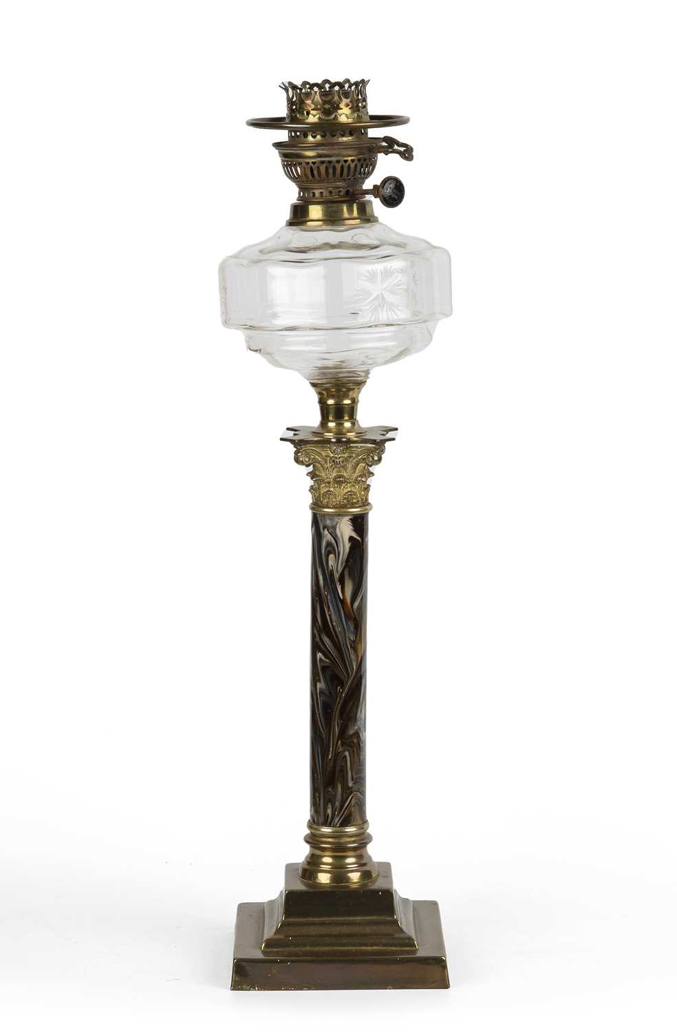 A late 19th / early 20th century German oil lamp with a cut glass well, a marble enamelled
