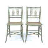 A pair of regency faux bamboo occasional chairs with later paint and caned seats 40cm wide 83cm