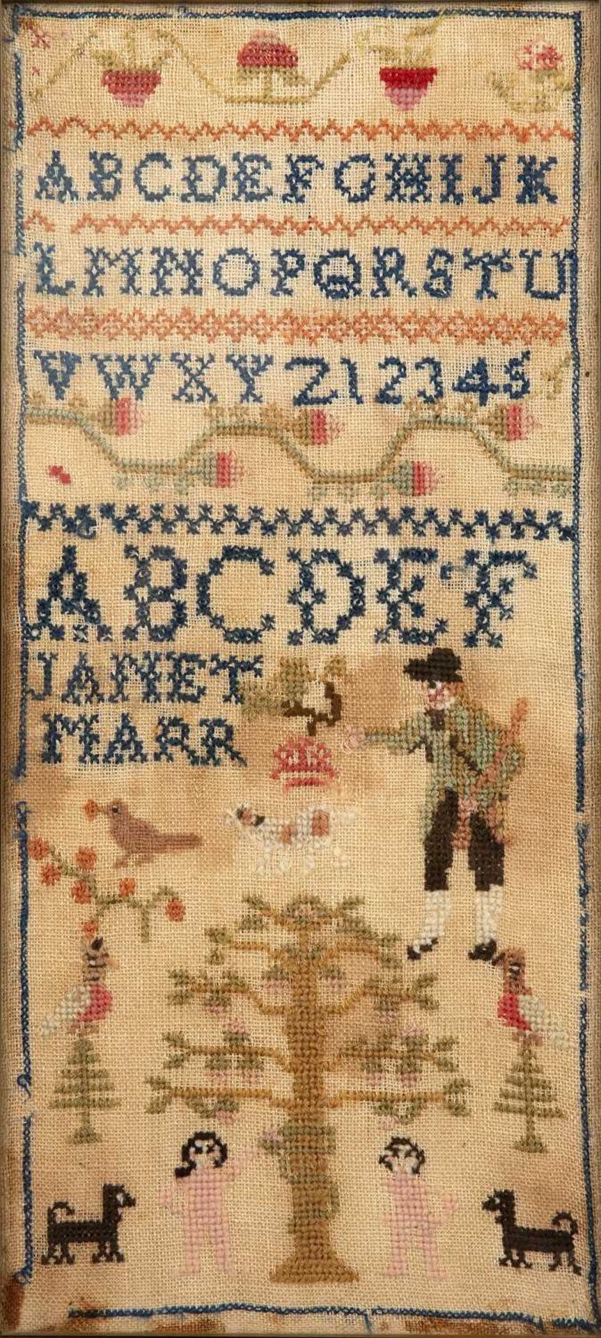 A late 19th century woolwork Alphabet sampler worked by Janet Marr 44cm x 19cm some stains