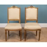 A pair of French gilt carved wood side chairs