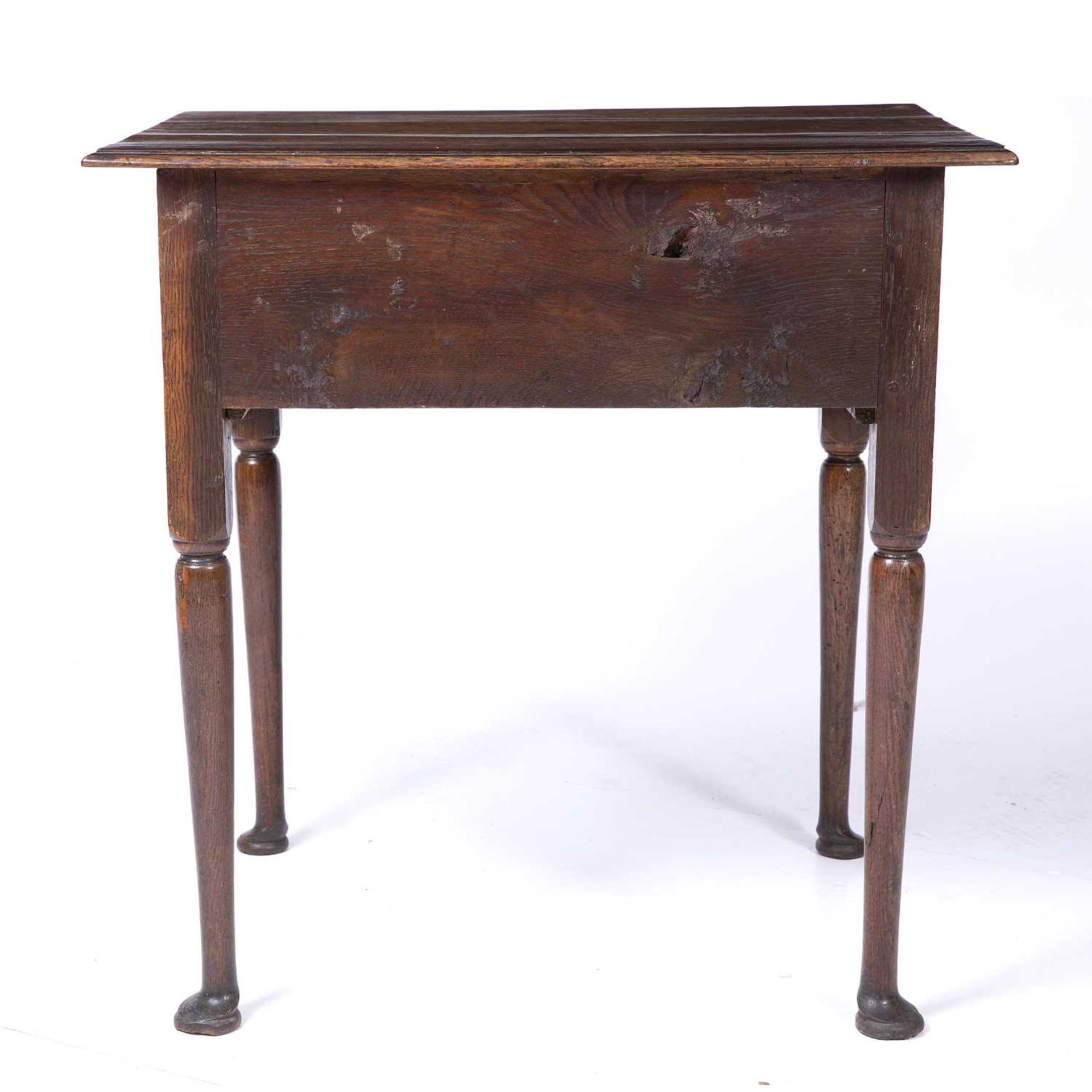 An 18th century oak low boy with three drawers and bras handles raised on turned legs and pad - Image 5 of 6