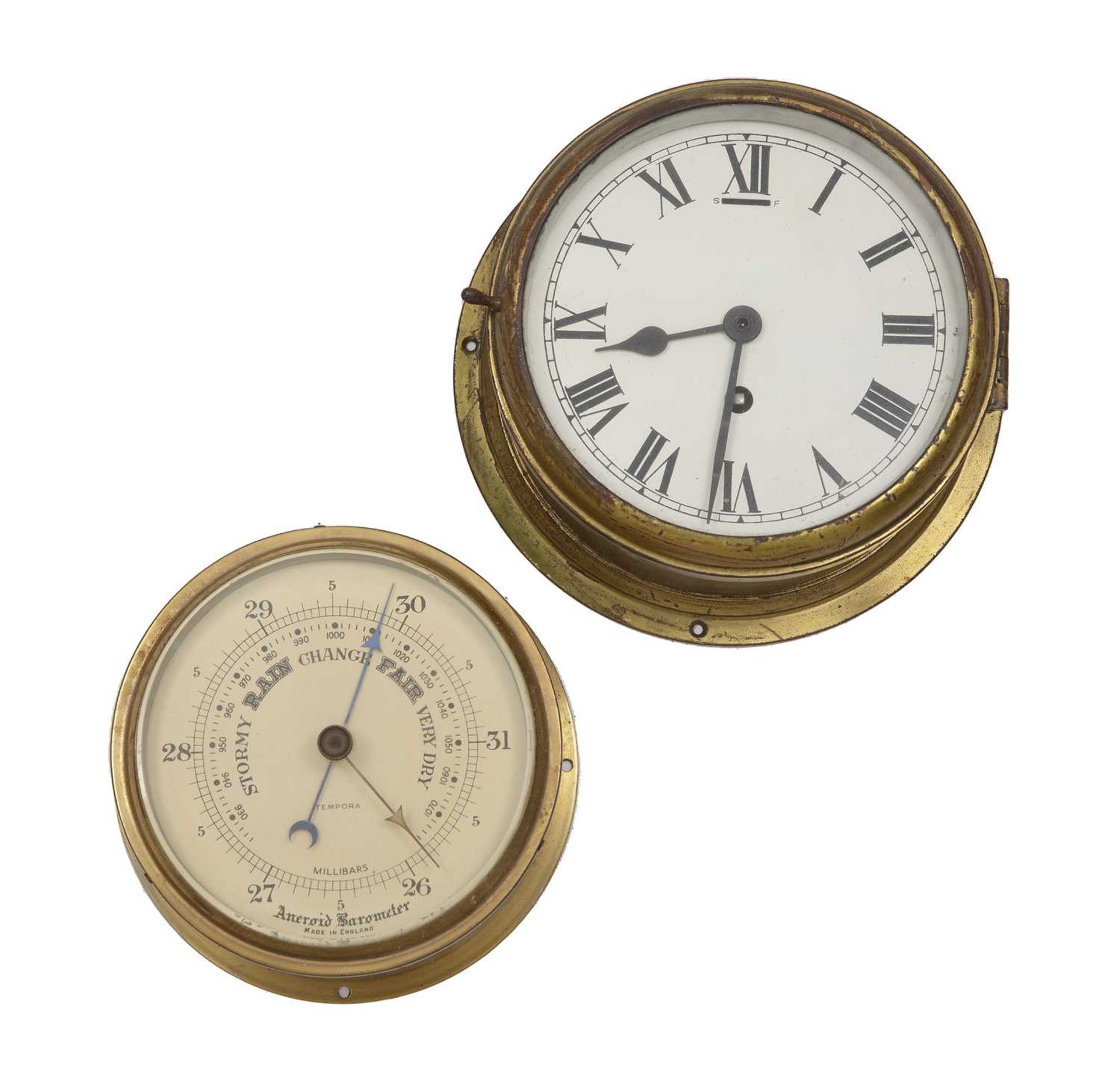 A ships clock with an enamelled dial with Roman numerals, 22cm diameter; together with a ships