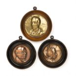 Three embossed copper and brass roundels depicting characters from Dickens Pickwick papers including