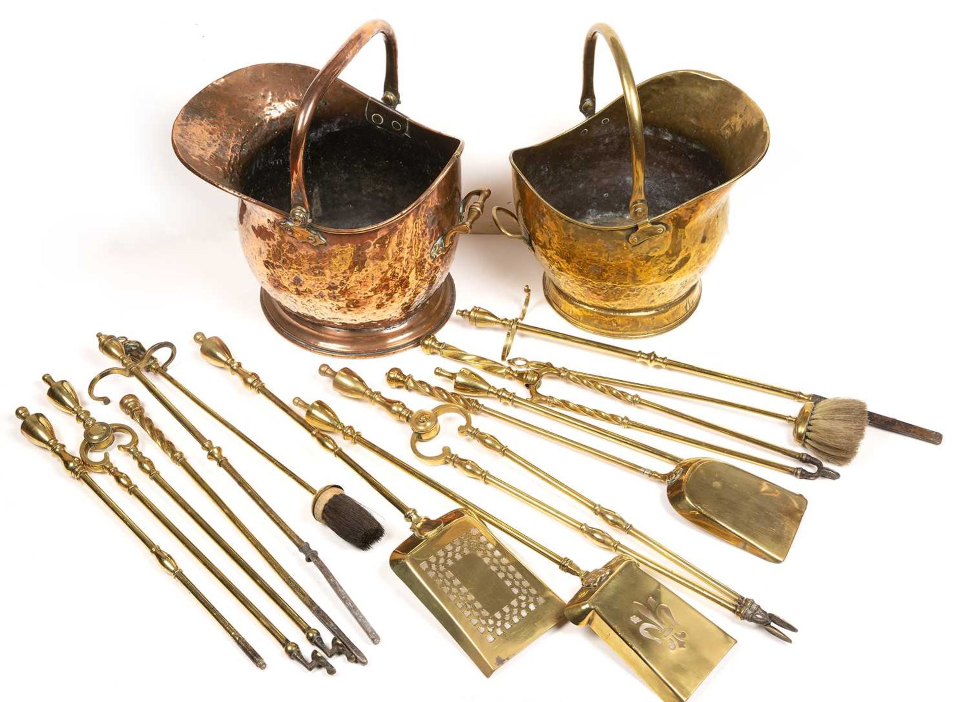 A 19th century copper coal scuttle, a brass coal scuttle and two sets of 19th century brass fire - Image 2 of 2