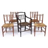 A set of four red painted Regency faux bamboo chairs with rush seats together with a similar