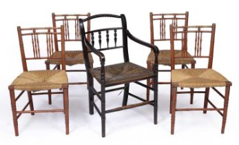 A set of four red painted Regency faux bamboo chairs with rush seats together with a similar
