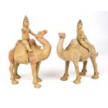 A pair of Chinese Tang style camels with riders each 17cm high 24cm high. Untested From a private