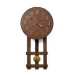 Arts and Crafts Wall clock, circa 1930 oak with applied brass numbers and hands 81cm high.
