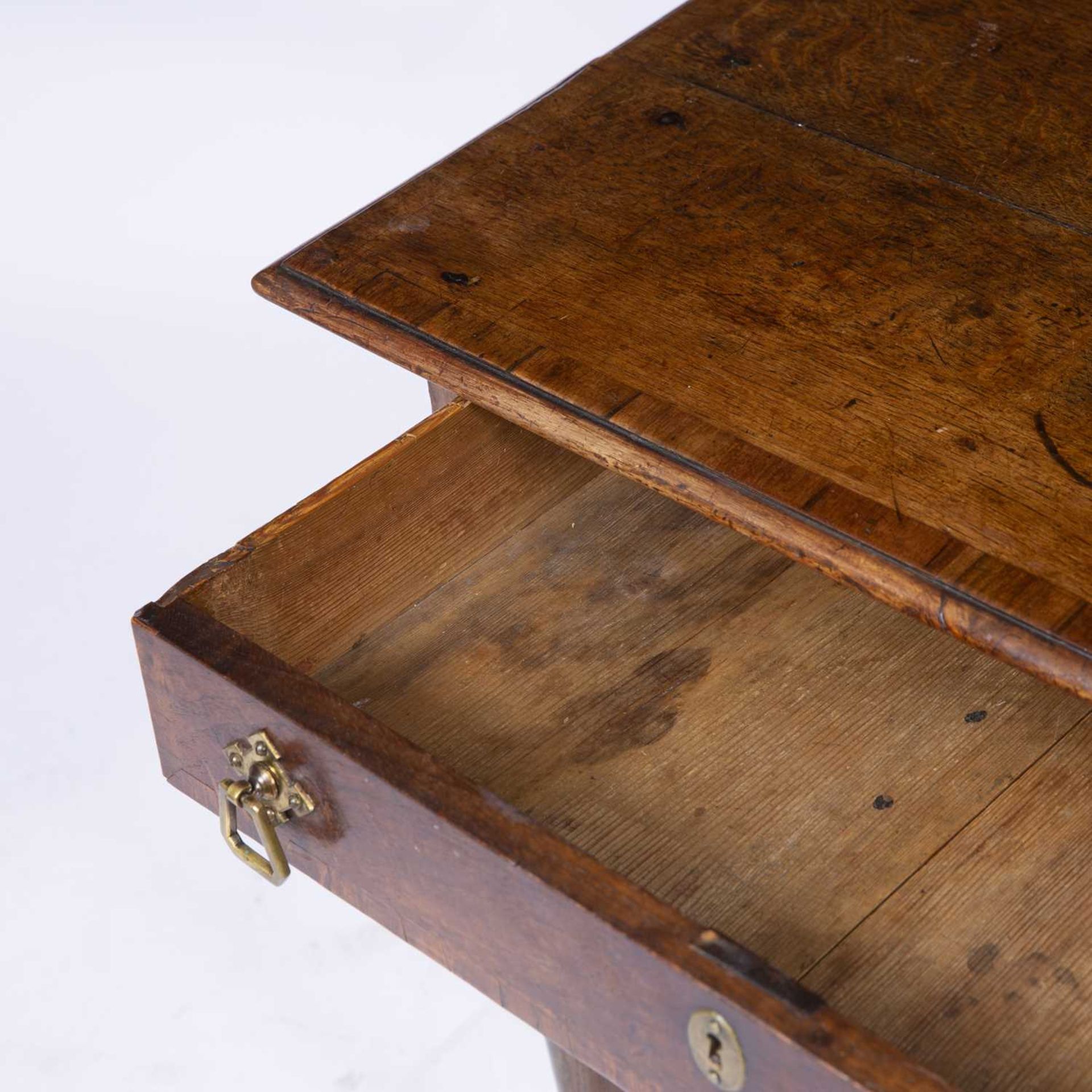 An 18th century oak low boy with three drawers and bras handles raised on turned legs and pad - Image 4 of 6