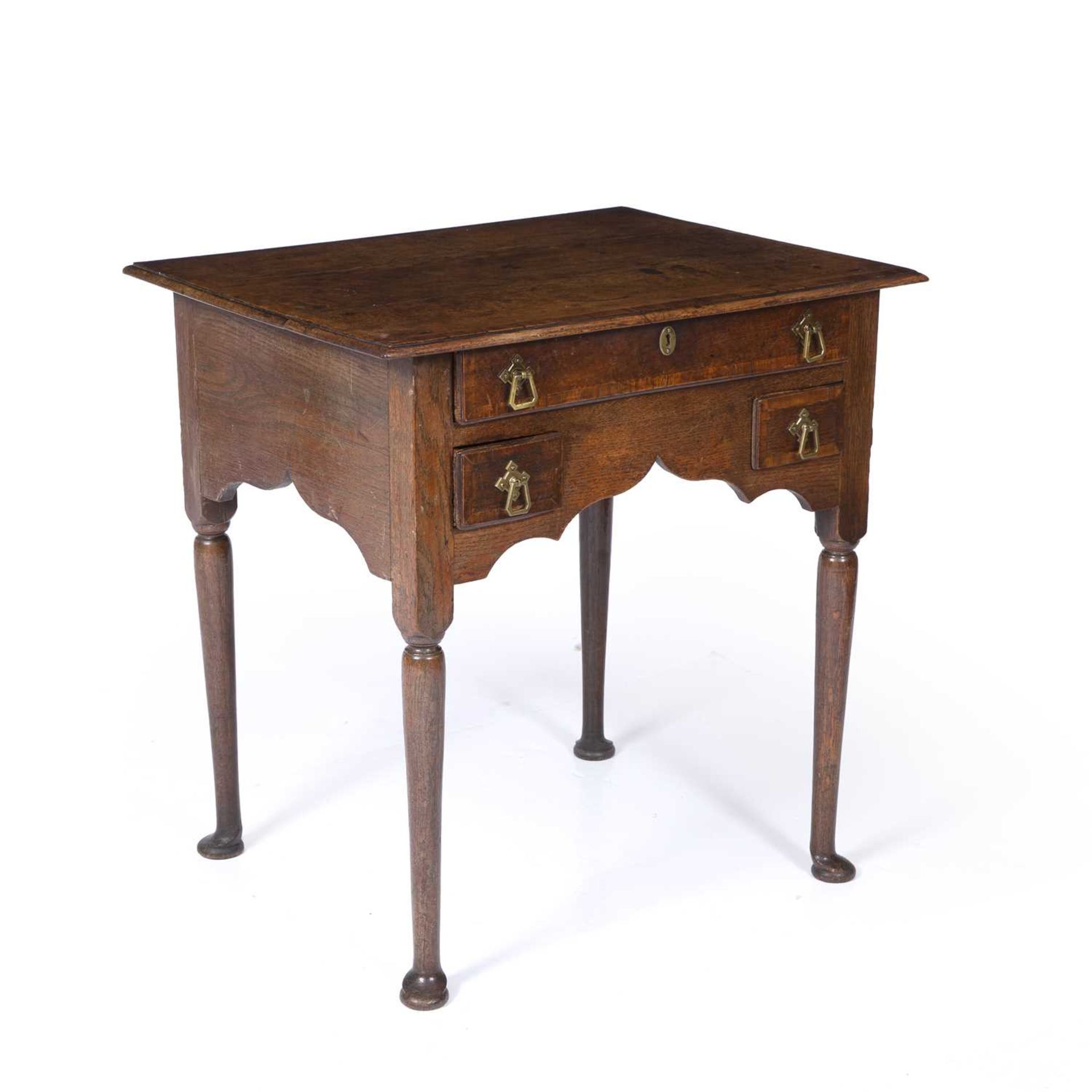 An 18th century oak low boy with three drawers and bras handles raised on turned legs and pad - Image 2 of 6