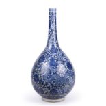 A large 18th/19th century Chinese blue and white dragon bottle vase. 22cm wide x 46cm high Qty: 1 In