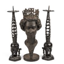 An iron bust of Queen Elizabeth, signed Bento da Cogolo, 15cm wide x 37cm high; together with a pair