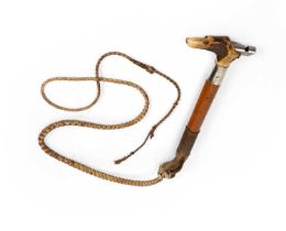 An early 20th century Hare coursing whip with a whistle and malacca shaft. 117cm. In a used