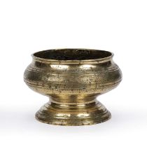 An antique Eastern brass bowl with engraved decoration 18cm wide x 12cm high Qty: 1 At present,