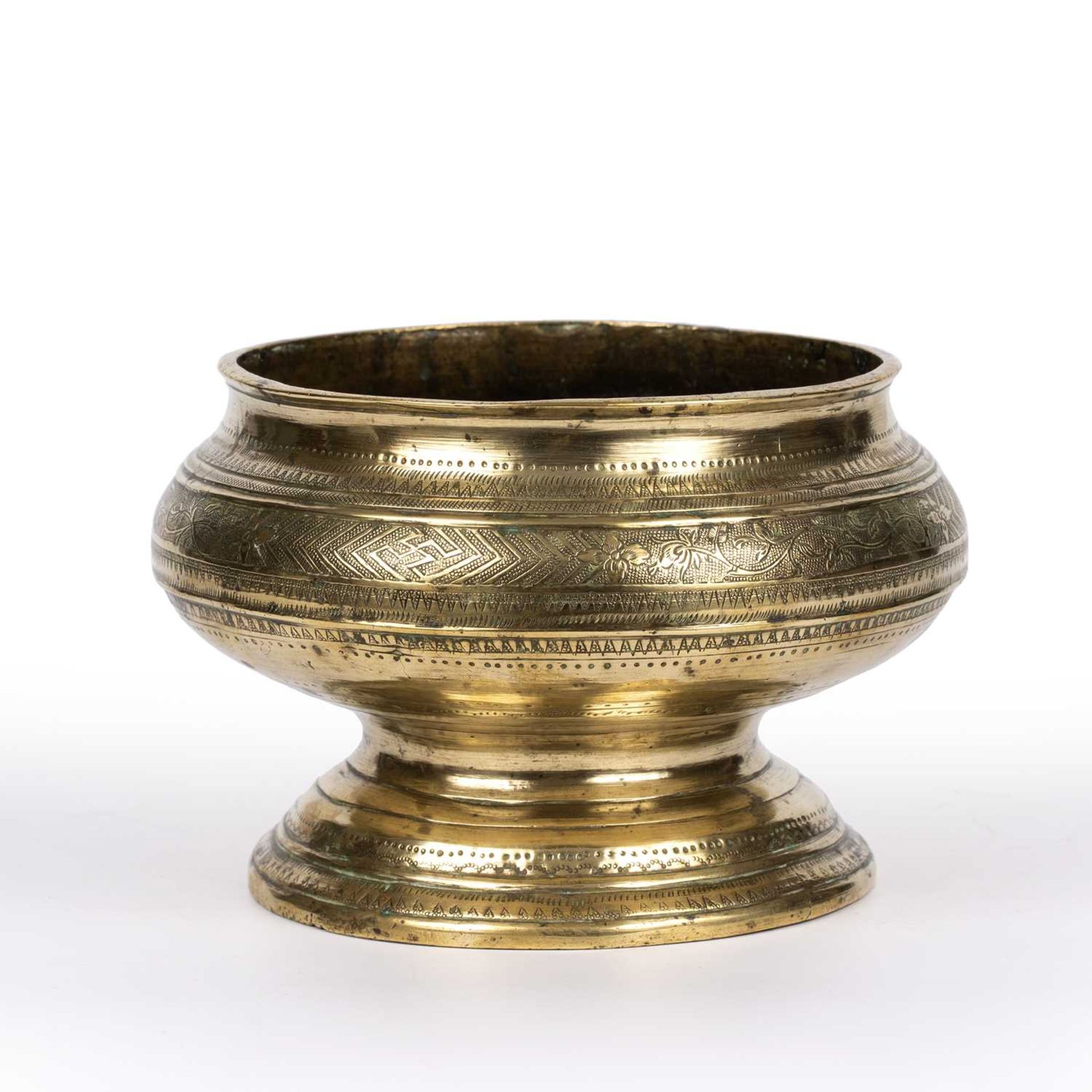 An antique Eastern brass bowl with engraved decoration 18cm wide x 12cm high Qty: 1 At present, - Image 2 of 4