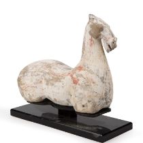 A Chinese Han dynasty (206 BC - 220 AD) painted pottery legless horse 29cm wide 24cm high. Sold with