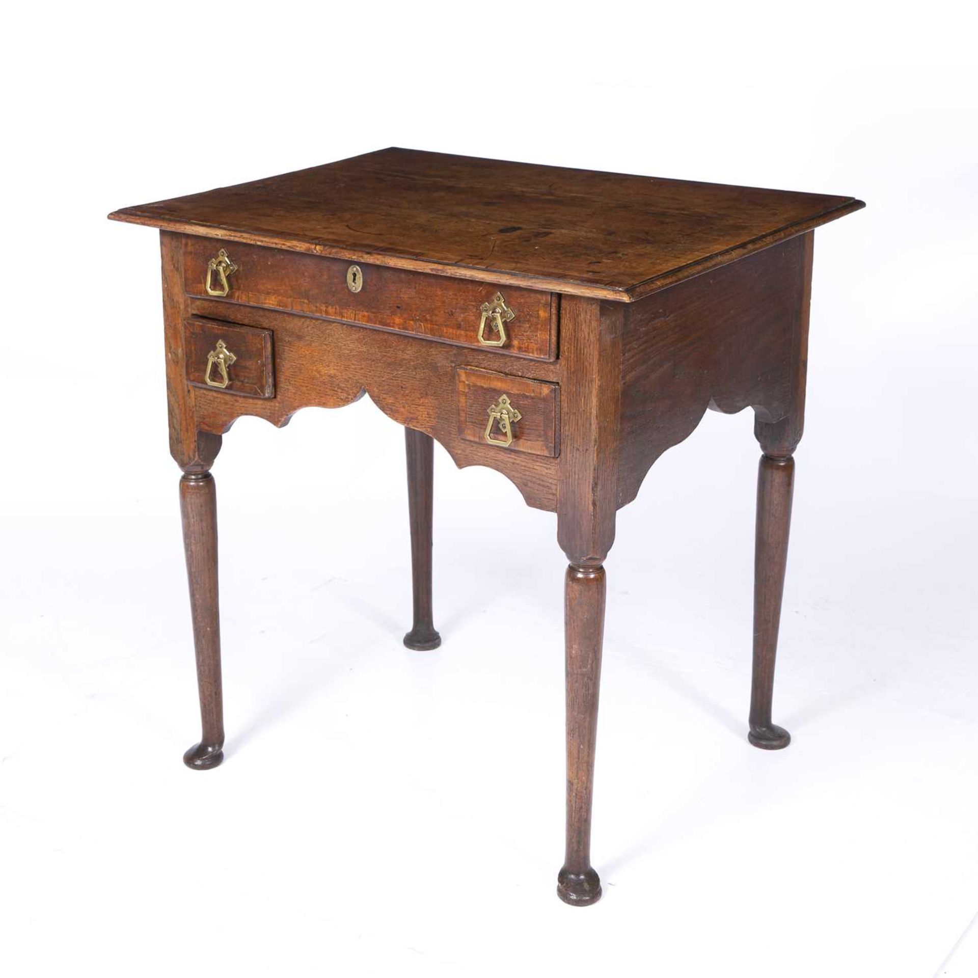 An 18th century oak low boy with three drawers and bras handles raised on turned legs and pad - Image 3 of 6