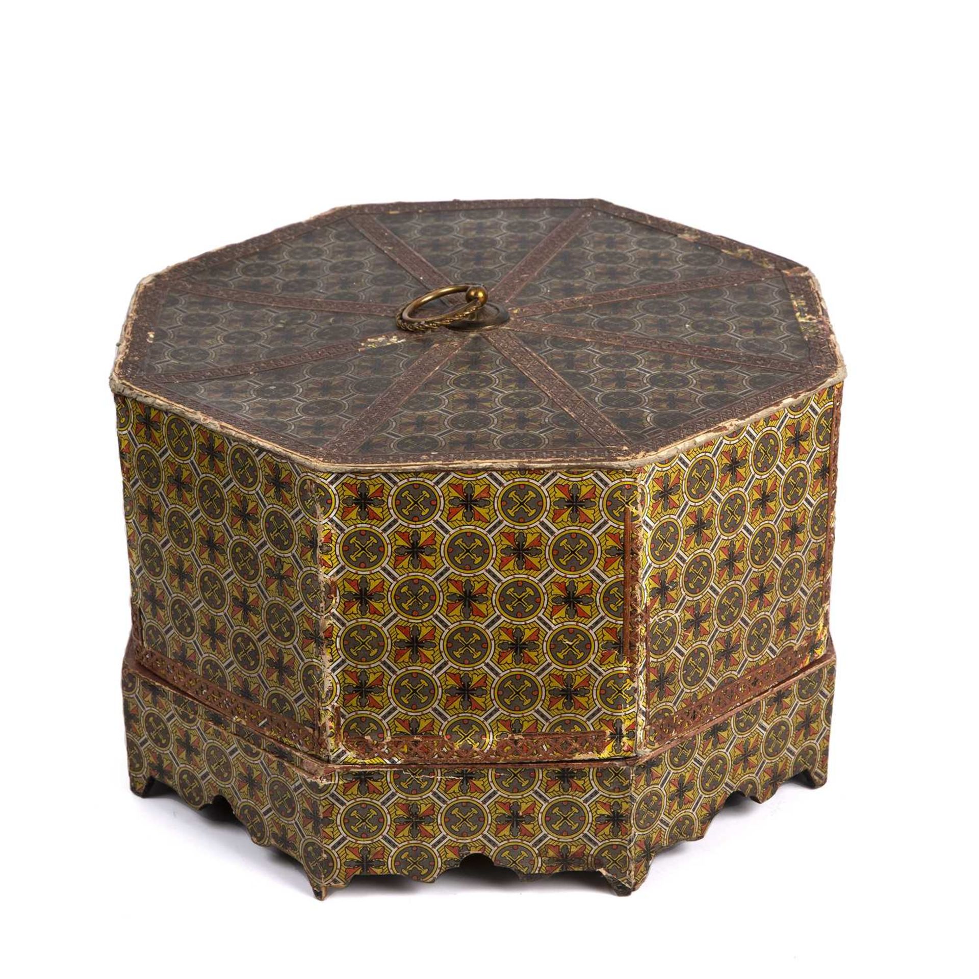 An early 20th century octagonal card box theatre together with a doll's porcelain tea set 32cm
