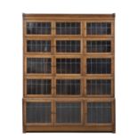 An early 20th century Minty oak bookcase with fifteen lead glazed door. 134cm wide 30cm deep 71cm