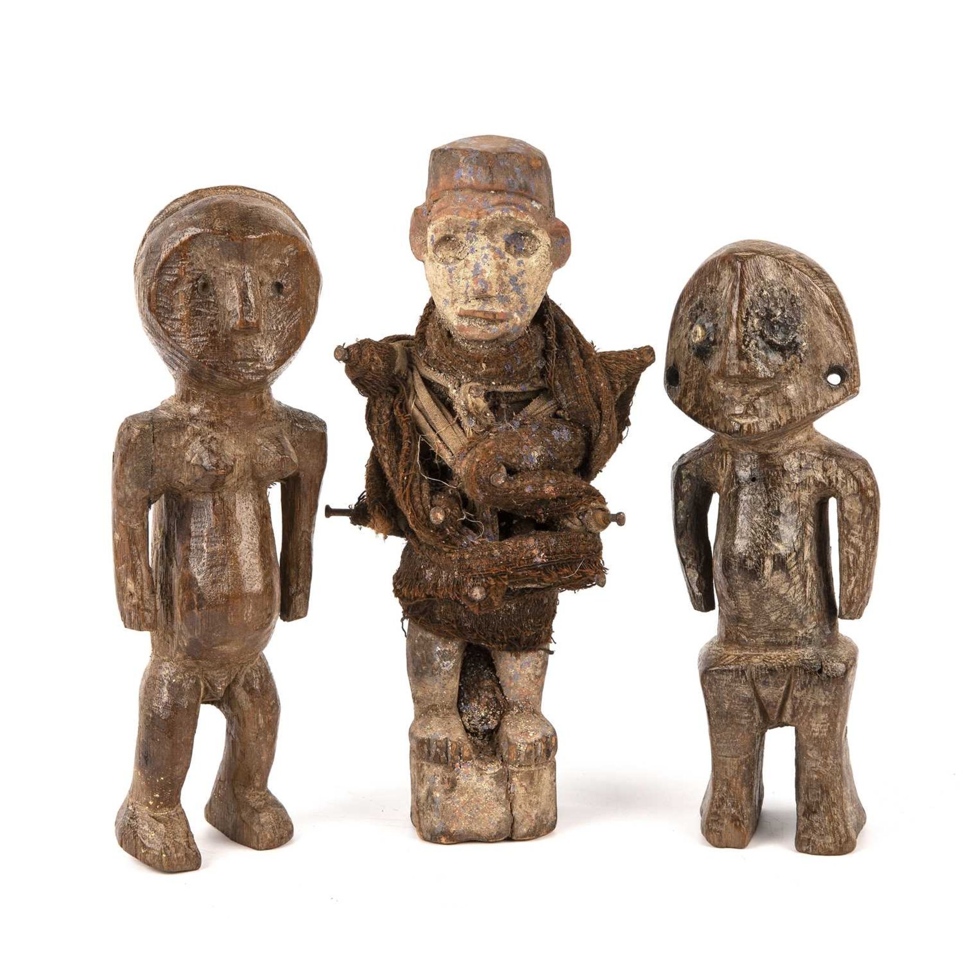 An African fetish figure 27cm high and two Congo figures 24cm high. Good with several smal surface